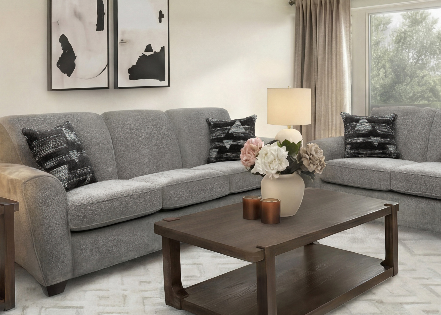 Grey sofa and loveseat set in a furnished living room