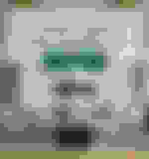 Living Room Setup with Grey Leather sofa, accent tables, and an Area Rug